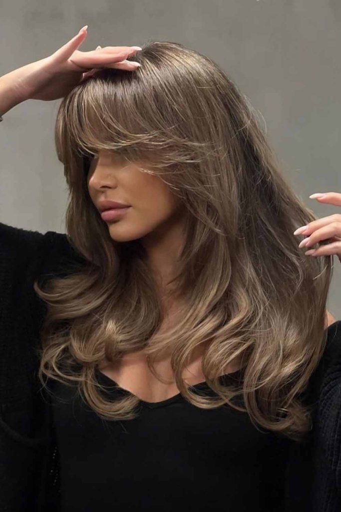 Bronde Balayage Hair with Butterfly Cut and Curtain Bangs