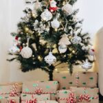 bundle of gifts near Christmas tree