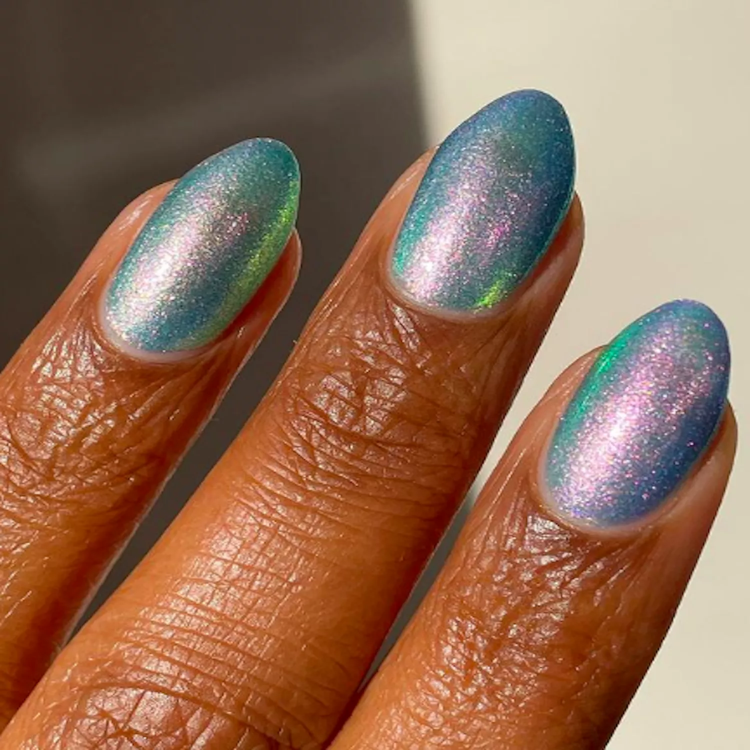 metallic blue, green, and purple mermaid nails