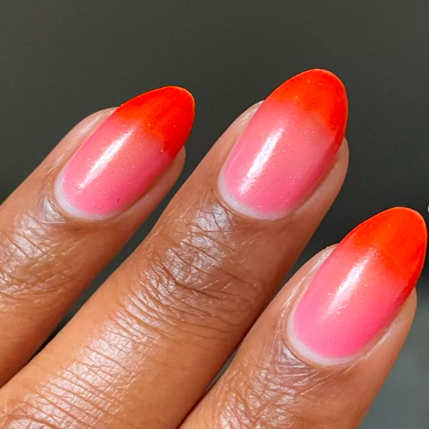 thermal color-changing manicure in coral and red shades