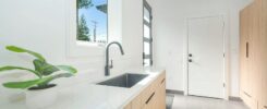 white ceramic sink with stainless steel faucet