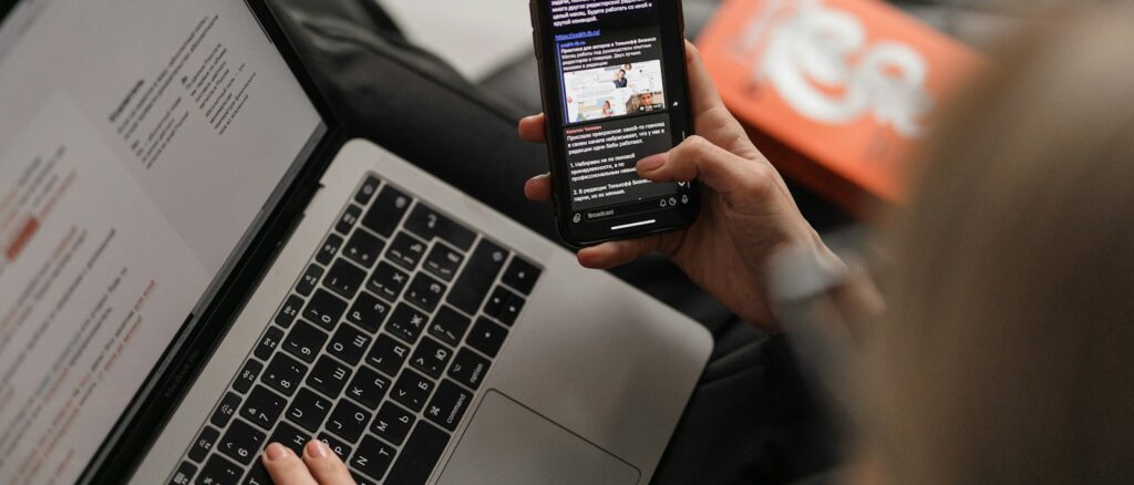 person holding black iphone 4