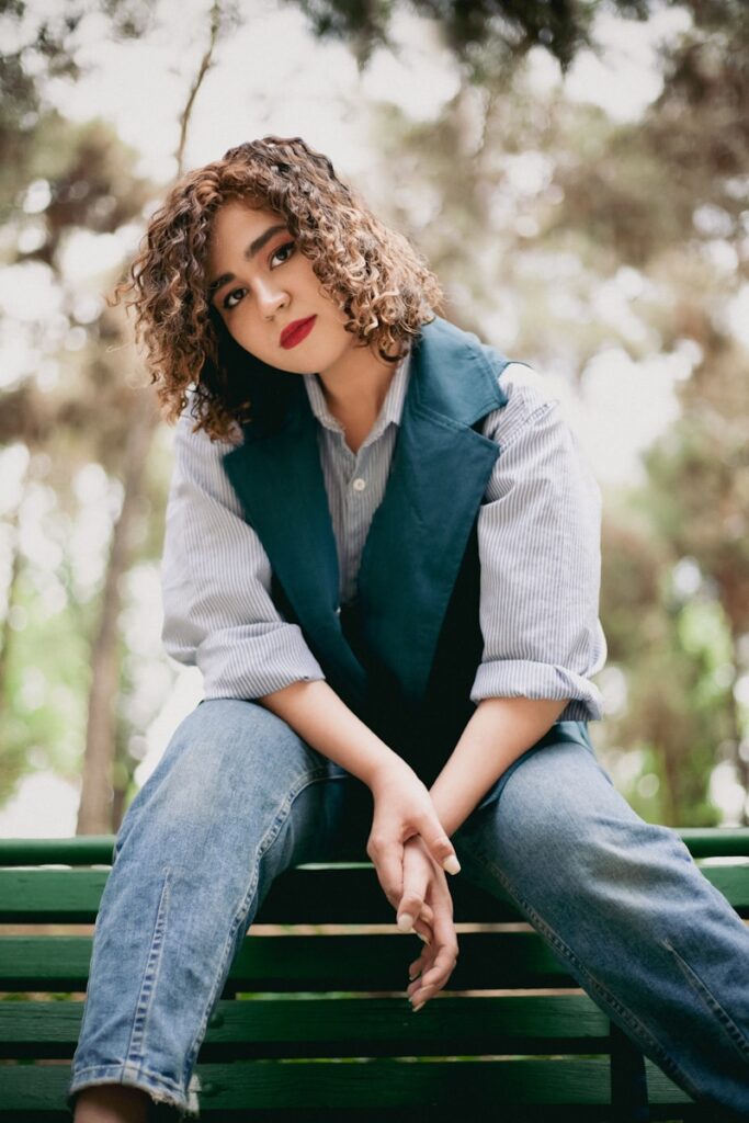 a woman sitting on a bench