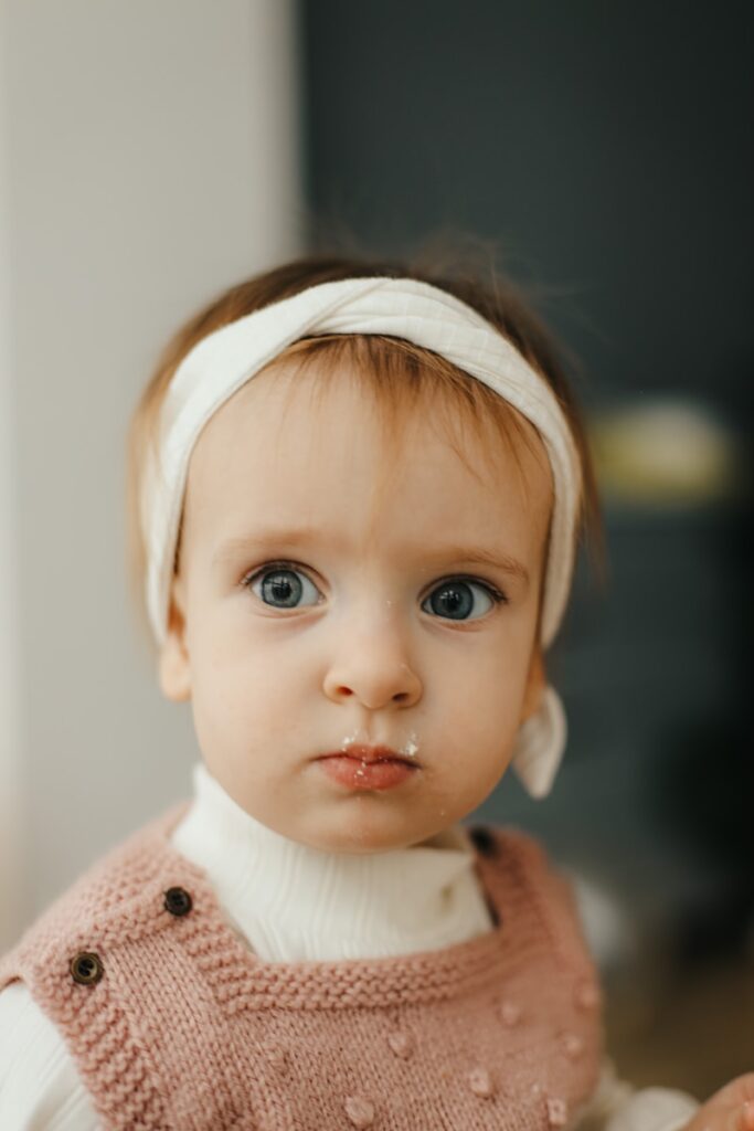 a baby with a surprised expression
