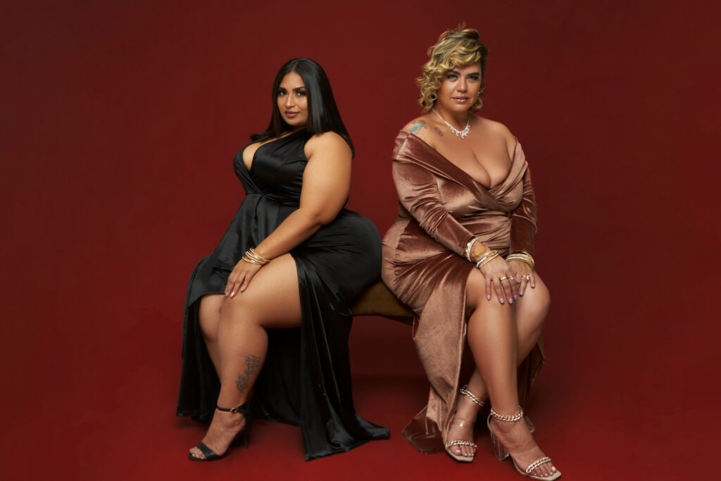 a couple of women sitting next to each other