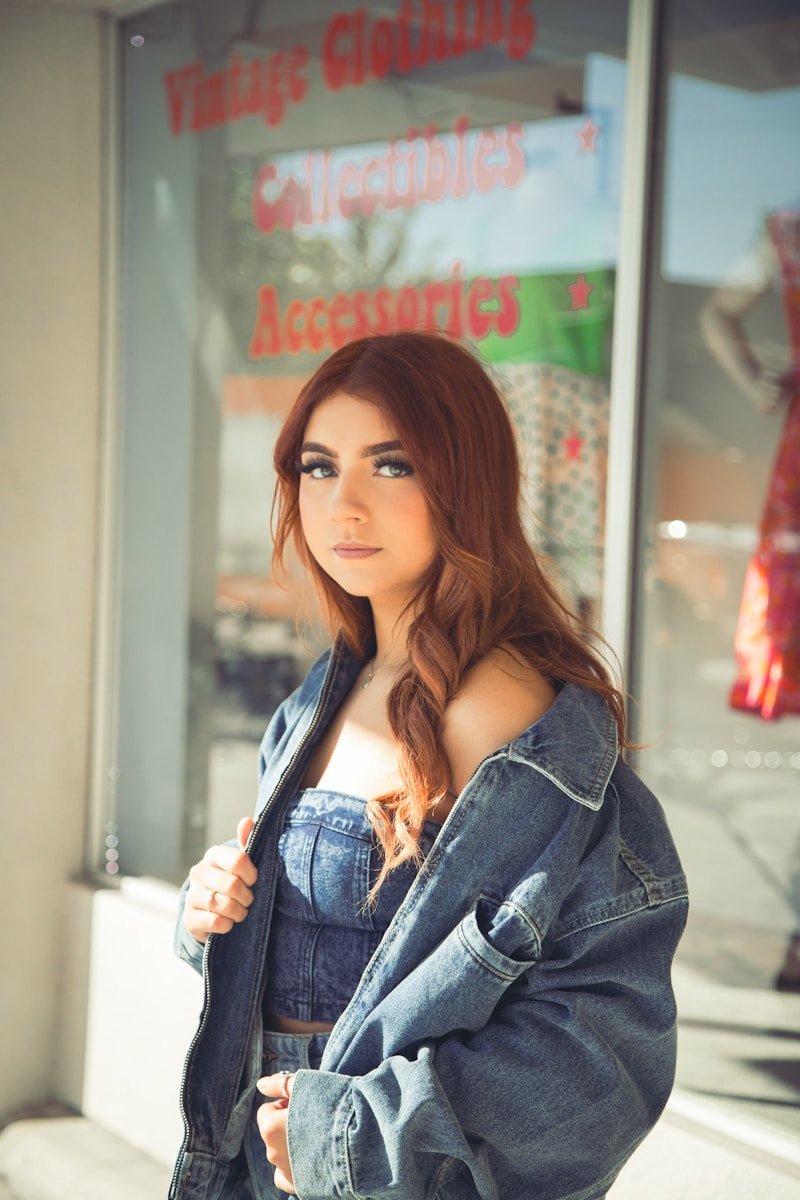 a woman standing in front of a store window