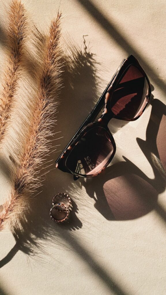 black framed sunglasses on white and black textile