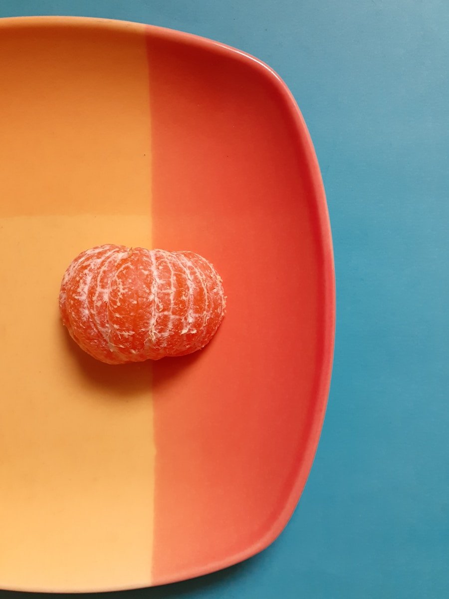 a peeled orange sitting on a plate on a table