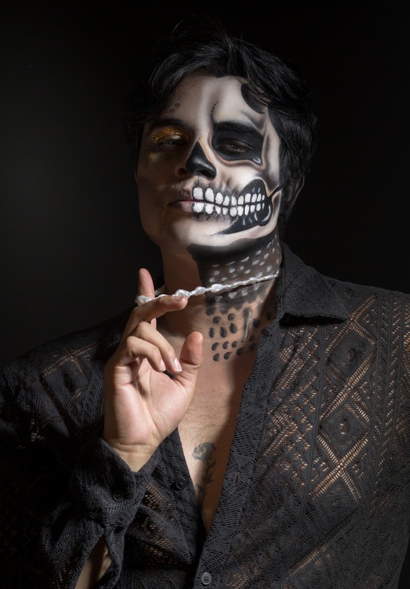 a person with a skull and cross bones