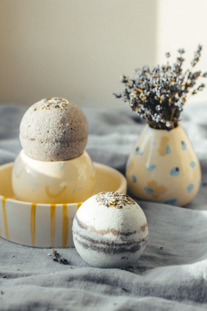 A soothing display of bath bombs and lavender in a vase, creating a spa-like atmosphere.