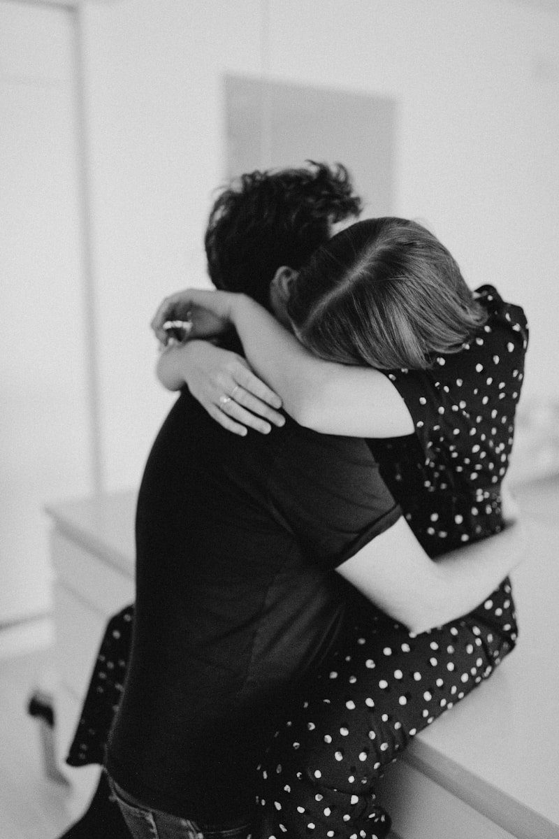 A couple of people that are hugging each other