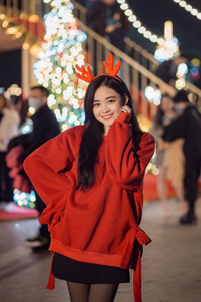 woman in red hijab standing near people