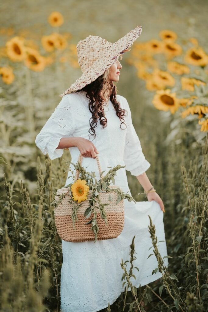 a woman standing in a field of sunflowers