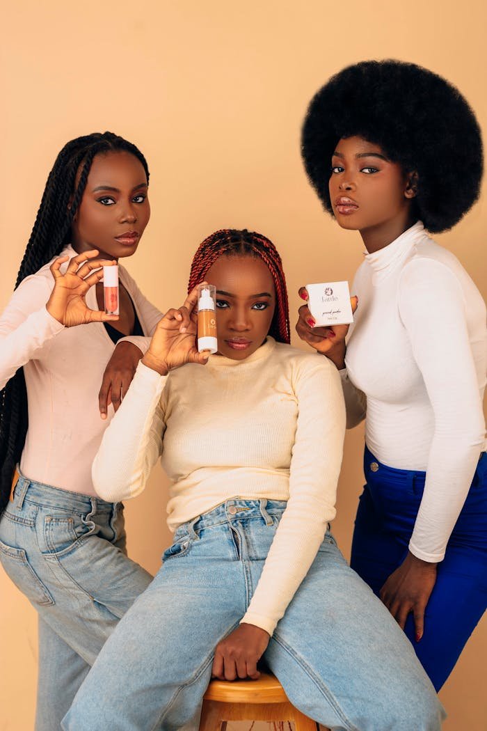 The Art of Drawing Readers In: Your attractive post title goes here Three women showcasing skincare items against a neutral background, highlighting beauty diversity.